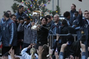 Defender Kosuke Kimura, who scored the goal that put the Colorado Rapids in the final, hoists the MLS Cup on Tuesday in Denver's Skyline Park. (Photograph by Jessica Taves/ColoradoSoccerNow.com.)